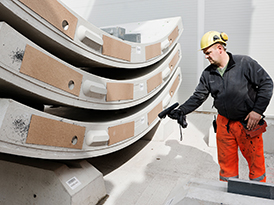 Worker scanning concrete segments