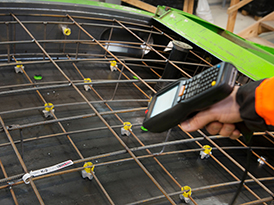 Worker scanning a wireframe label