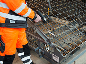 Worker scanning a wireframe label