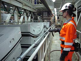 Worker scanning concrete elements