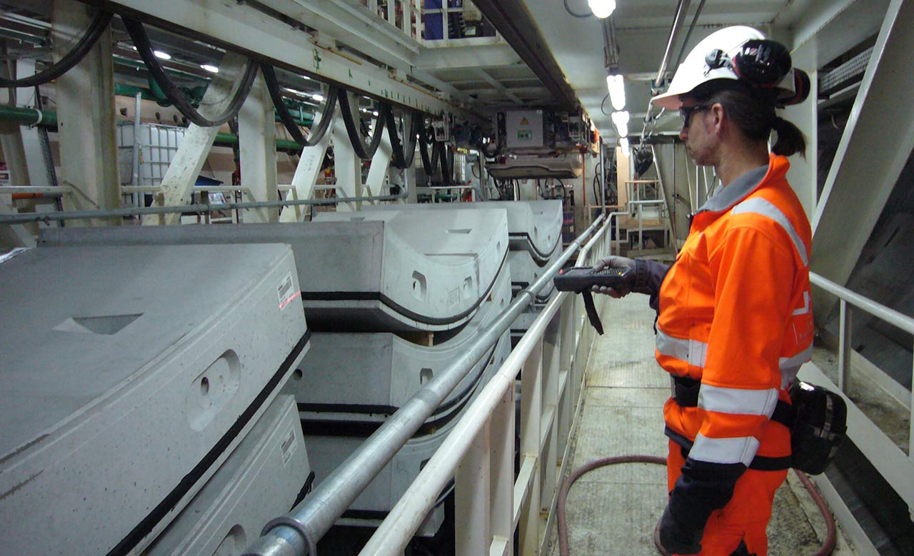 Worker scanning concrete elements