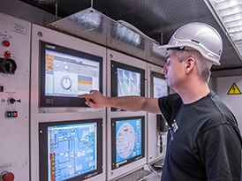 Worker on a control panel