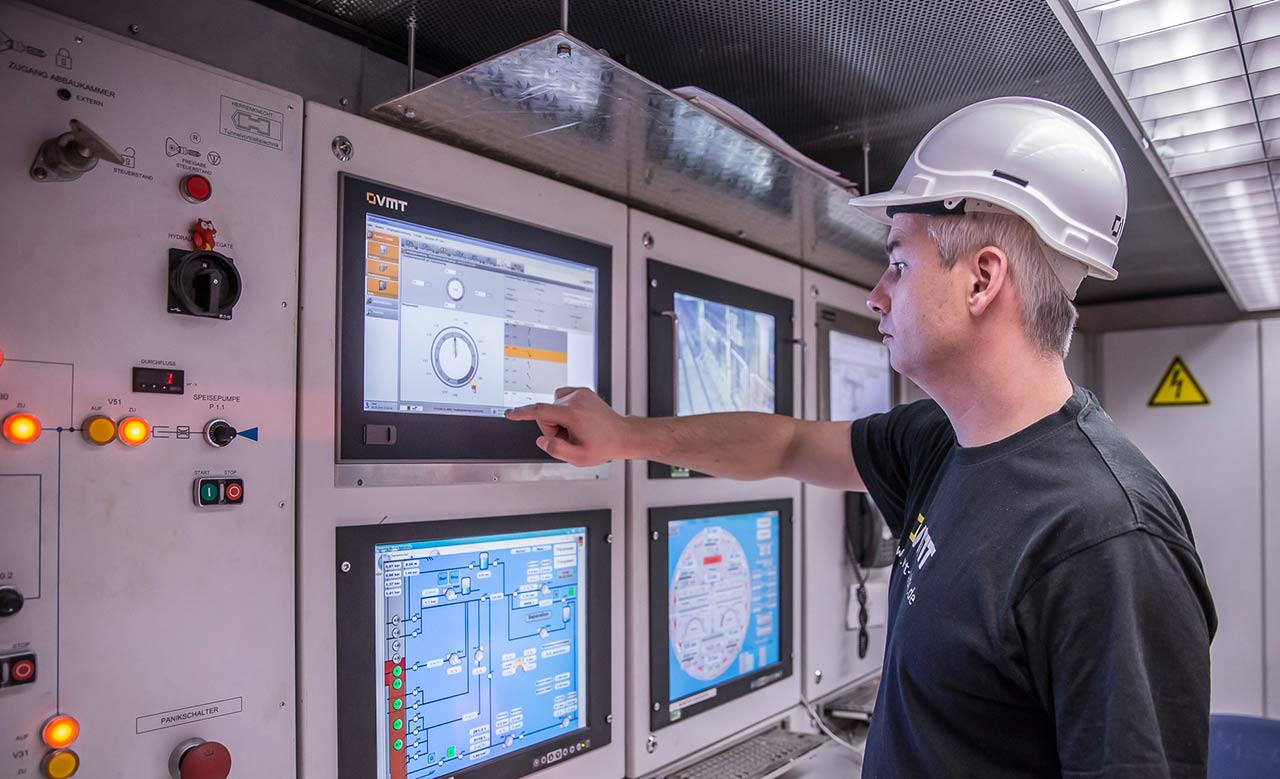 Worker on a control panel