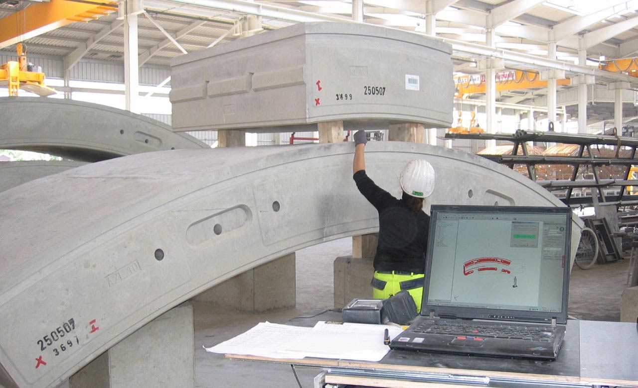 Worker checking concrete segments