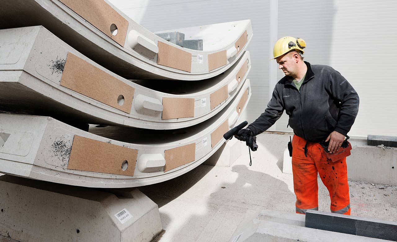 Worker scanning concrete segments